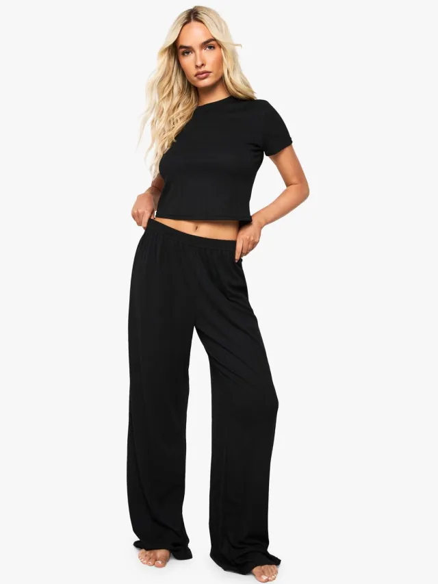 boohoo Dames Pointelle Baby T-shirt en pyjama set met wijde pijpen Zwart